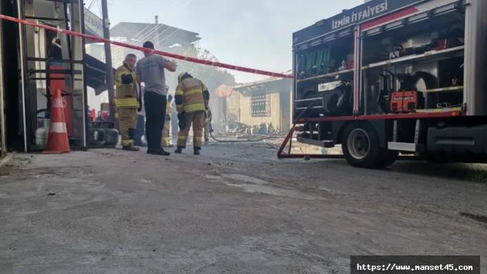 Mutfak tüplerinin de bulunduğu market deposunda korkutan yangın