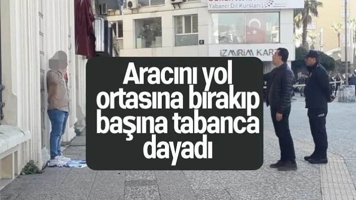 Aracını yol ortasına bırakıp başına tabanca dayadı