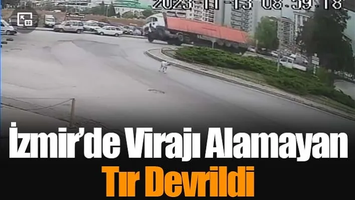 İzmir'de virajı alamayan tır devrildi